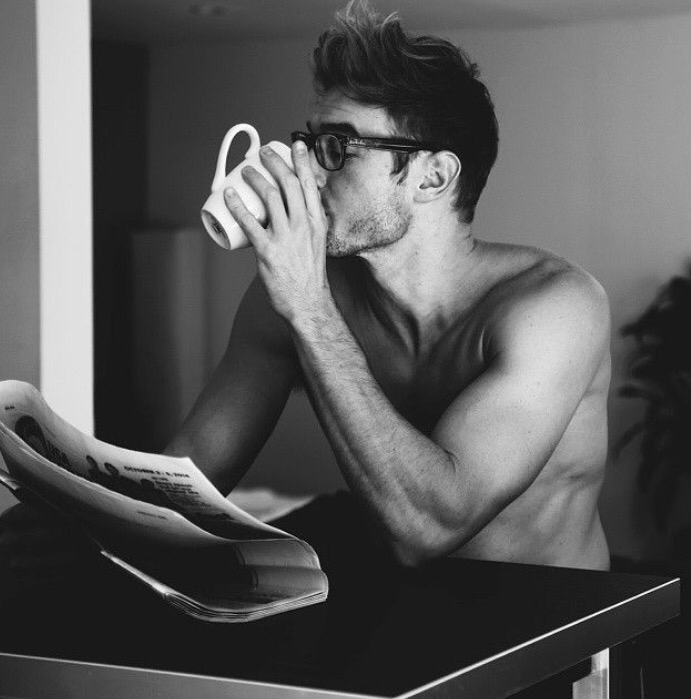 Hot guy drinking coffee. 